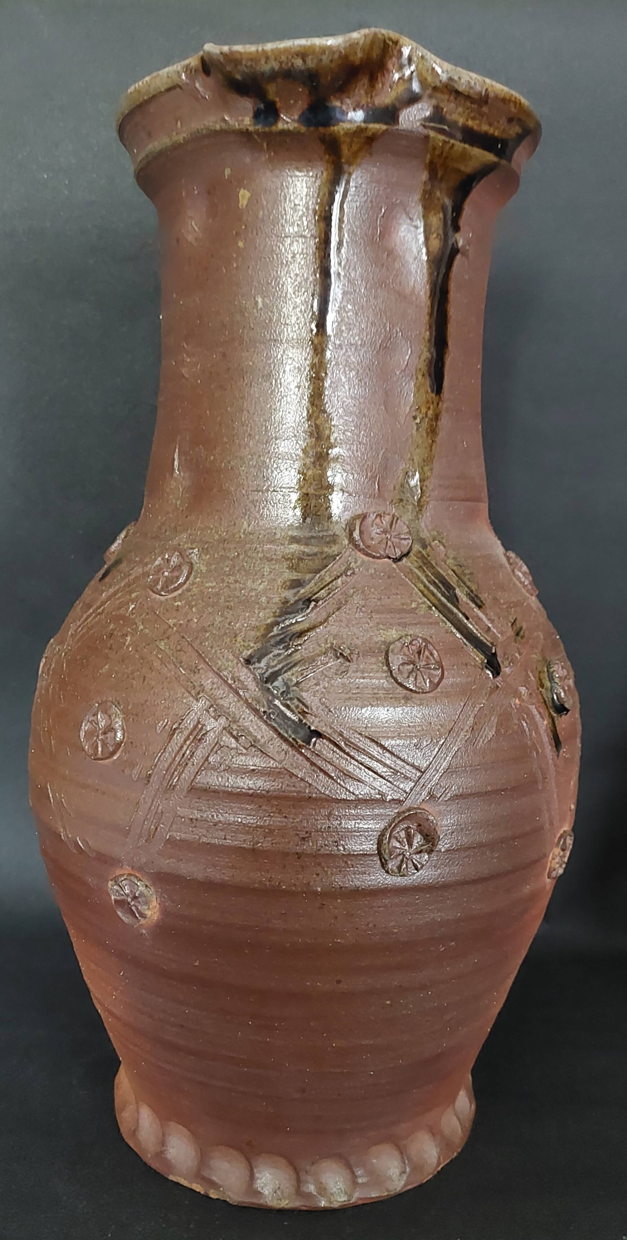 Vintage pitcher with a signature to identify.