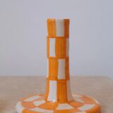 Pair of yellow and white checkered ceramic candlesticks