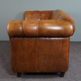 Sheepskin sofa with decorative nails