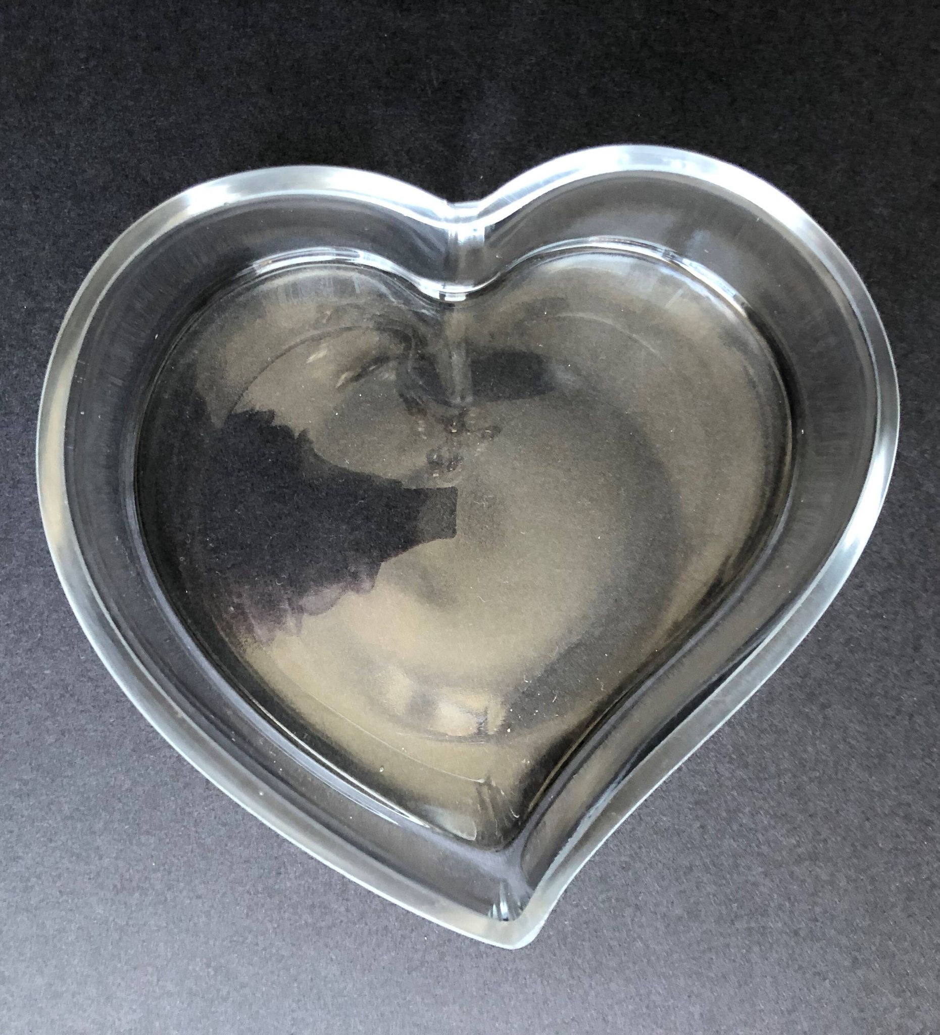 Empty glass heart-shaped pocket