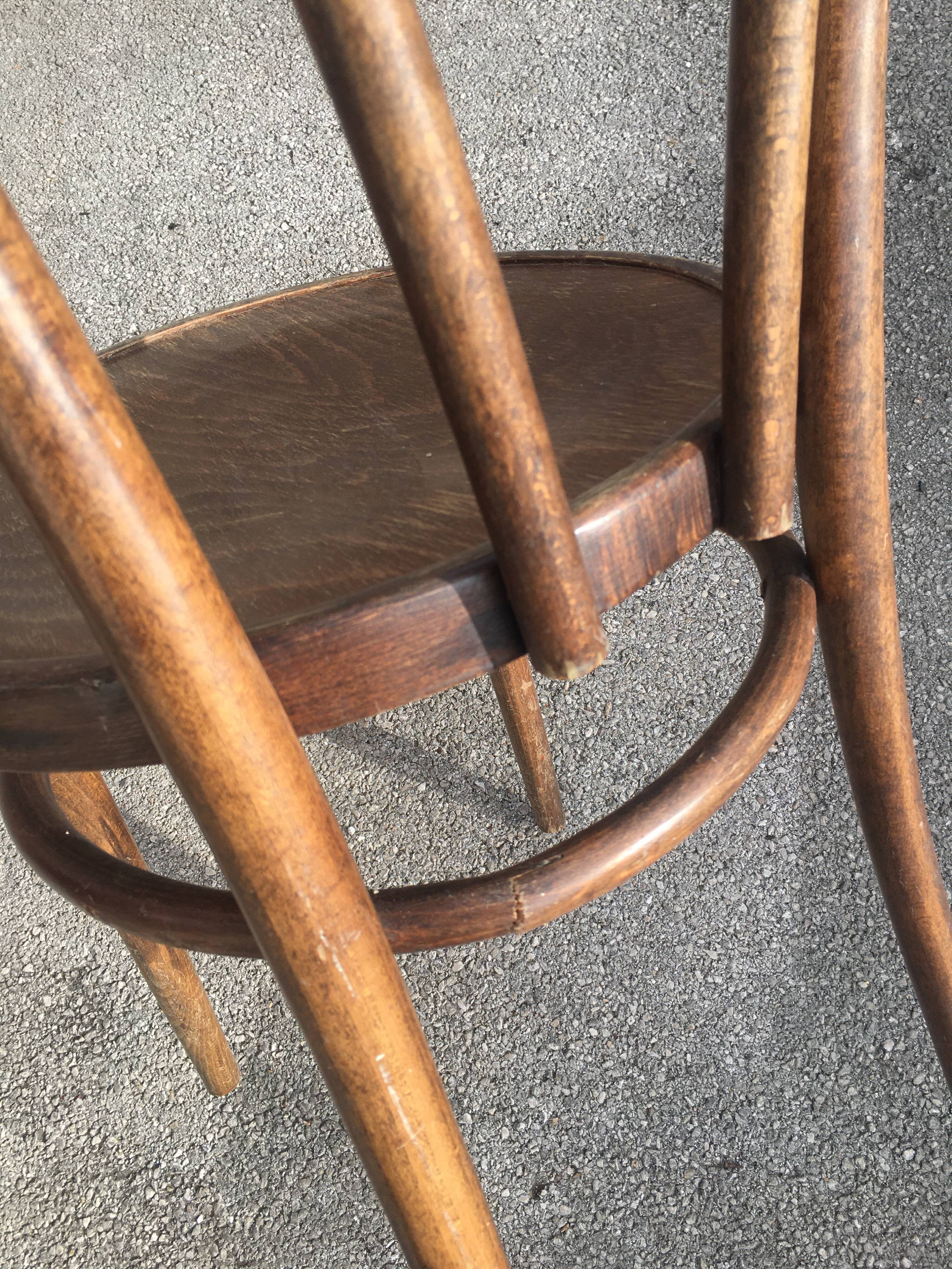 Six patinated bistro chairs