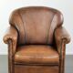 Comfortable characterful sheepskin armchair finished with decorative nails