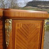 Louis XVI armoire with marquetry and gilded bronze