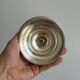 Silver-plated metal stand.