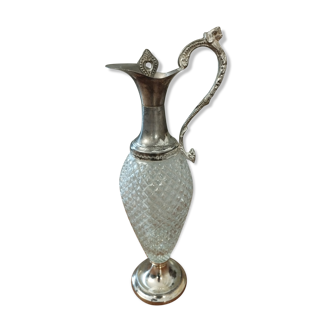 Old ewer in crystal and silver metal