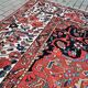 Ancient Persian carpet made of hand-woven wool. Very good condition.