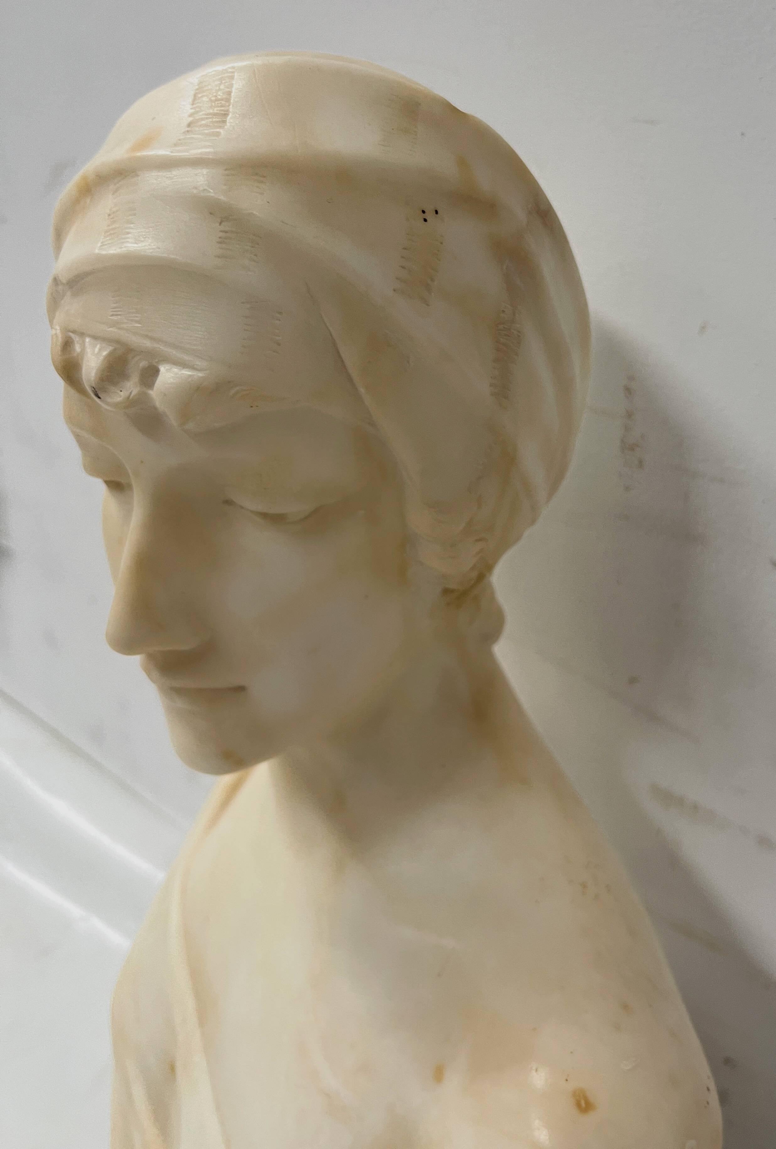 Sculpted marble group of a young woman's bust, 20th century.