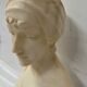 Sculpted marble group of a young woman's bust, 20th century.