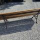 Wooden garden bench with cast iron base
