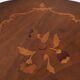 Pedestal table or side table, carved wooden legs, inlaid veneer on the top.