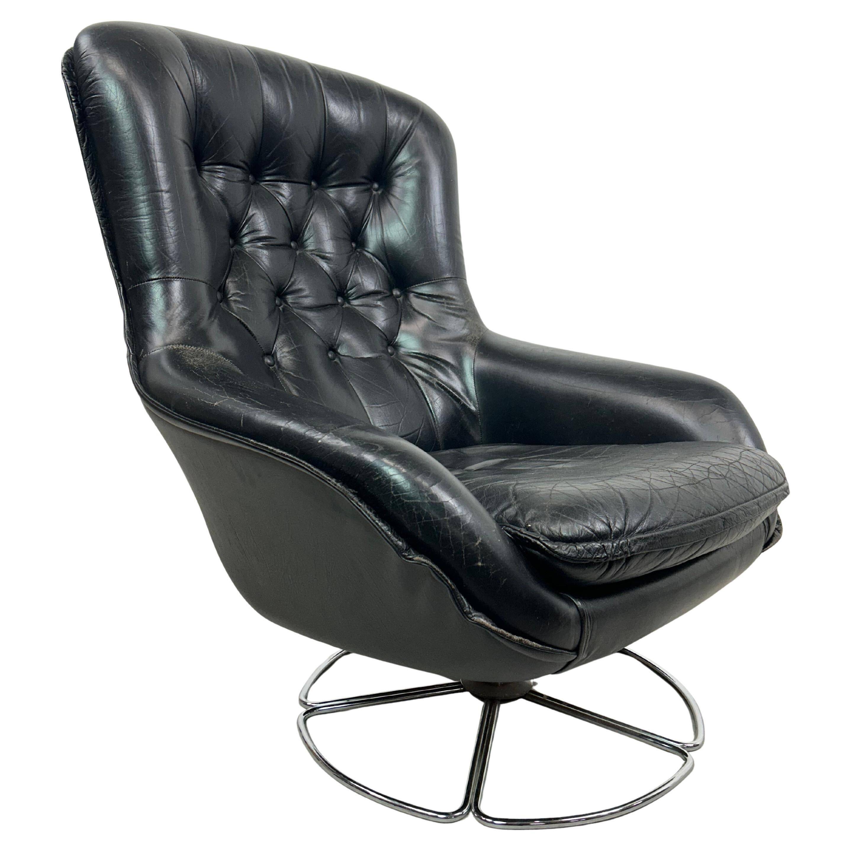 Black leather wingback swivel chair by PeeM