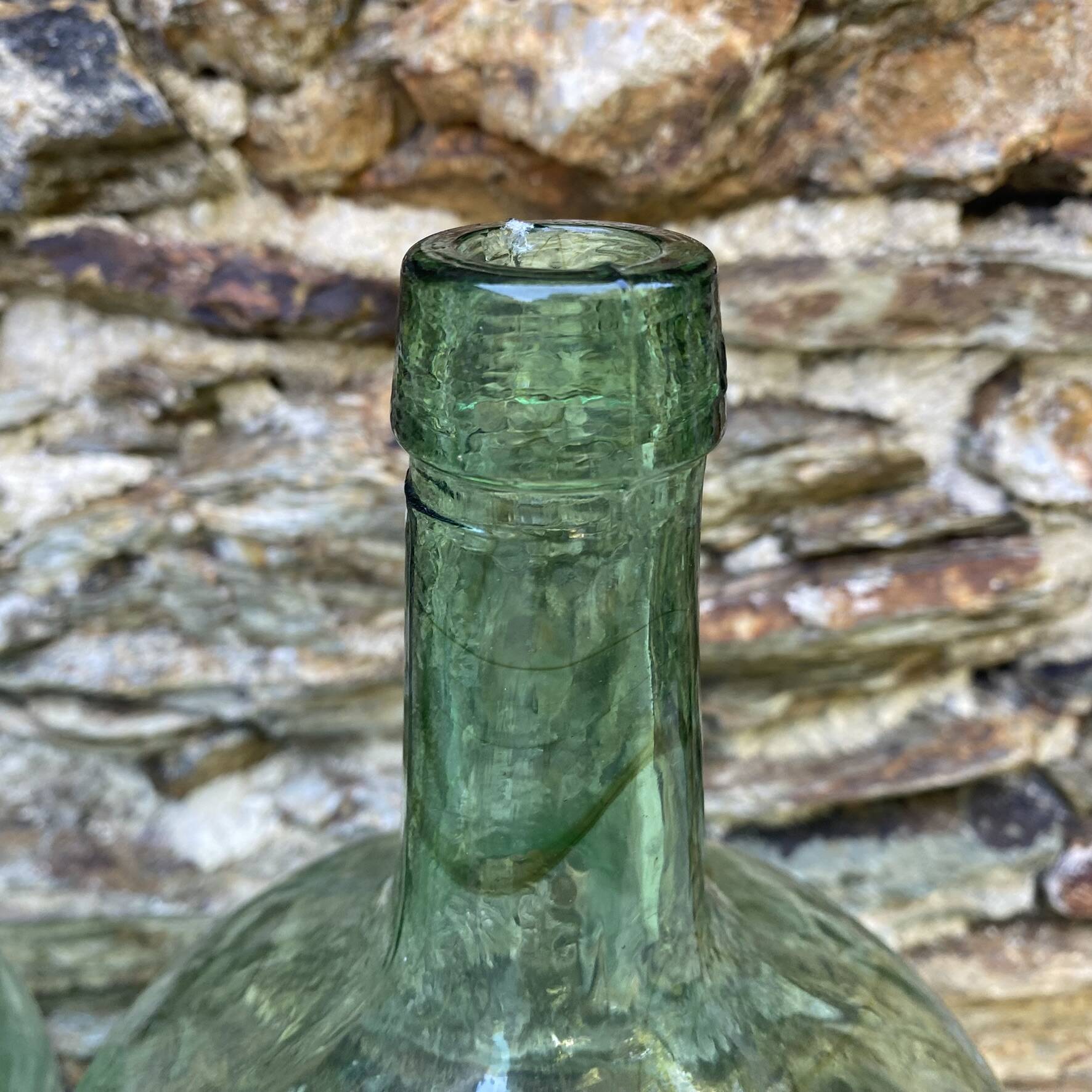set of tinted glass demijohns