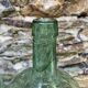 set of tinted glass demijohns