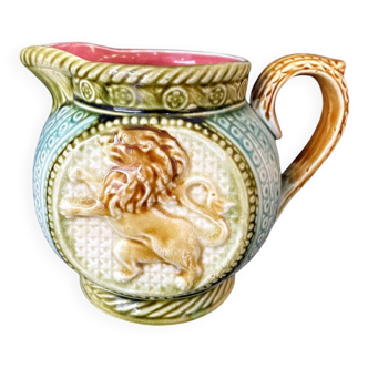 Small onnaing barbotine jug with lion decoration
