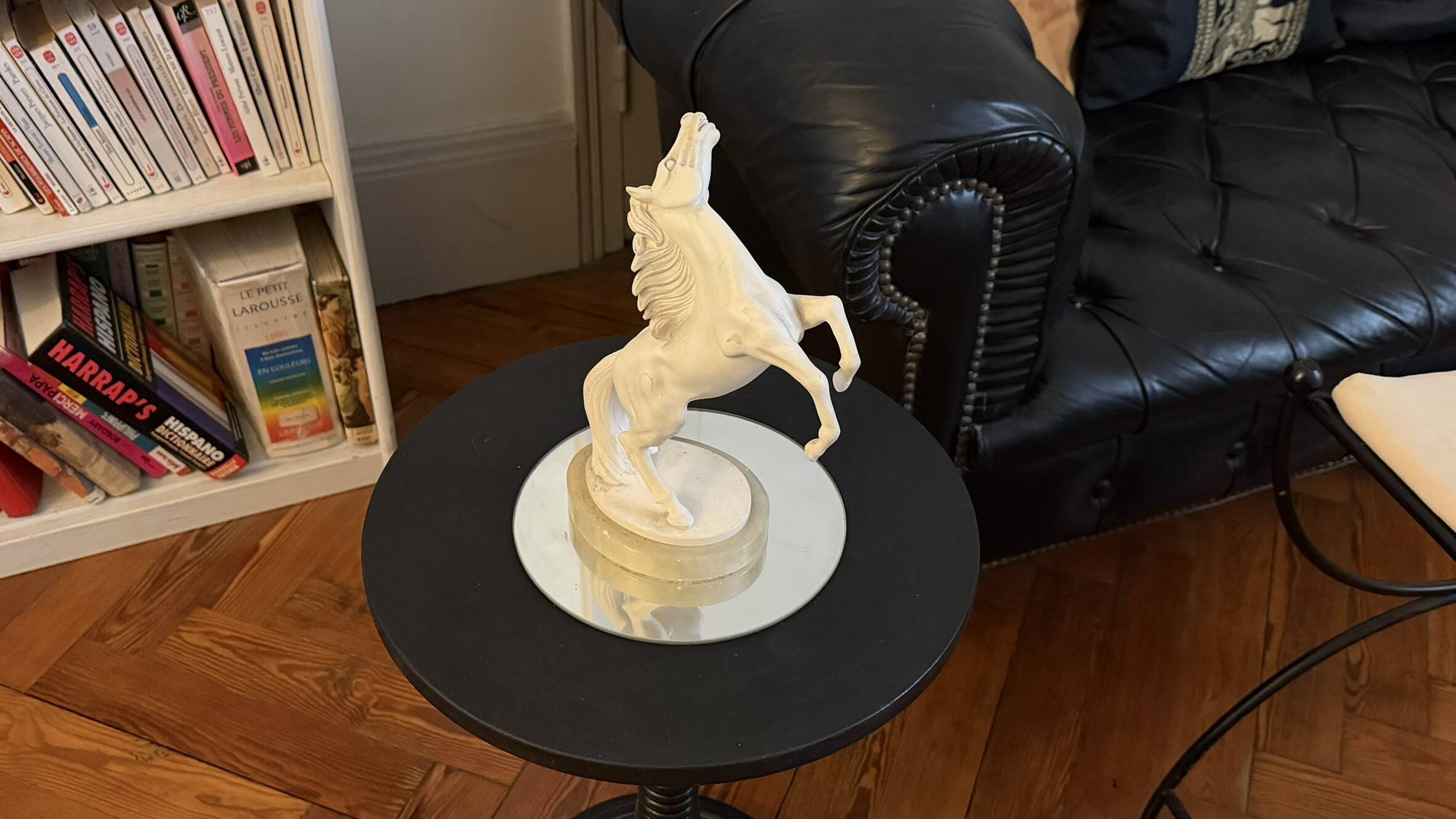 White rearing horse statuette