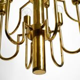 Three staged 18 arm Mid Century brass chandelier with a long brass rod