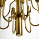 Three staged 18 arm Mid Century brass chandelier with a long brass rod
