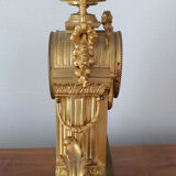 19th century clock in gilded bronze and alabaster