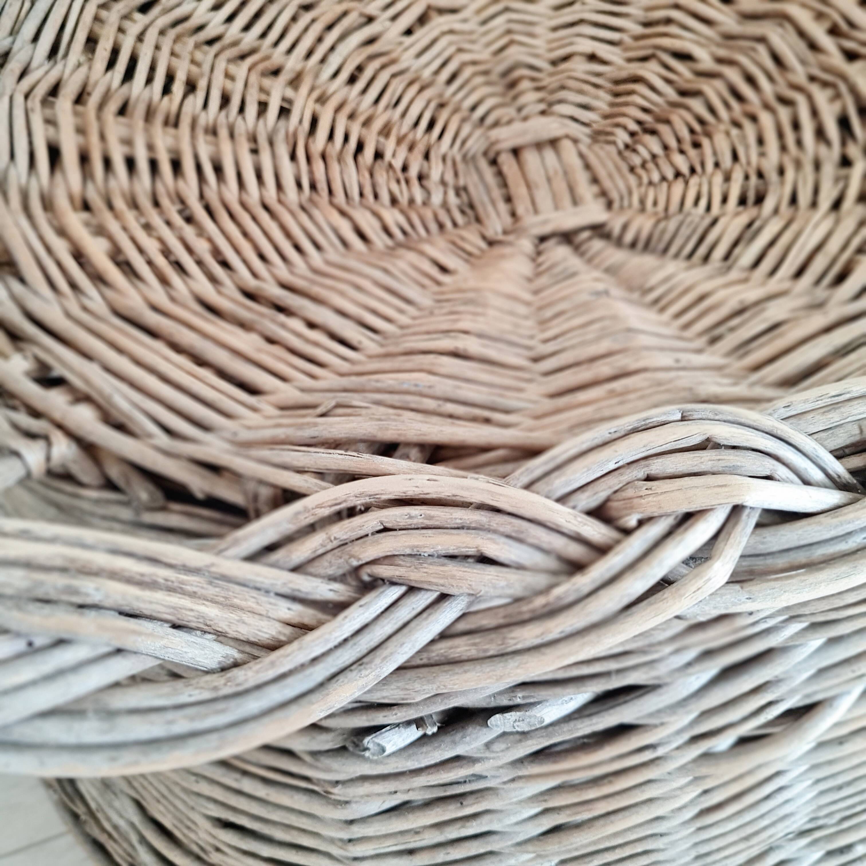 Antique armchair in gray woven wicker