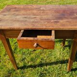 Wooden table with a drawer