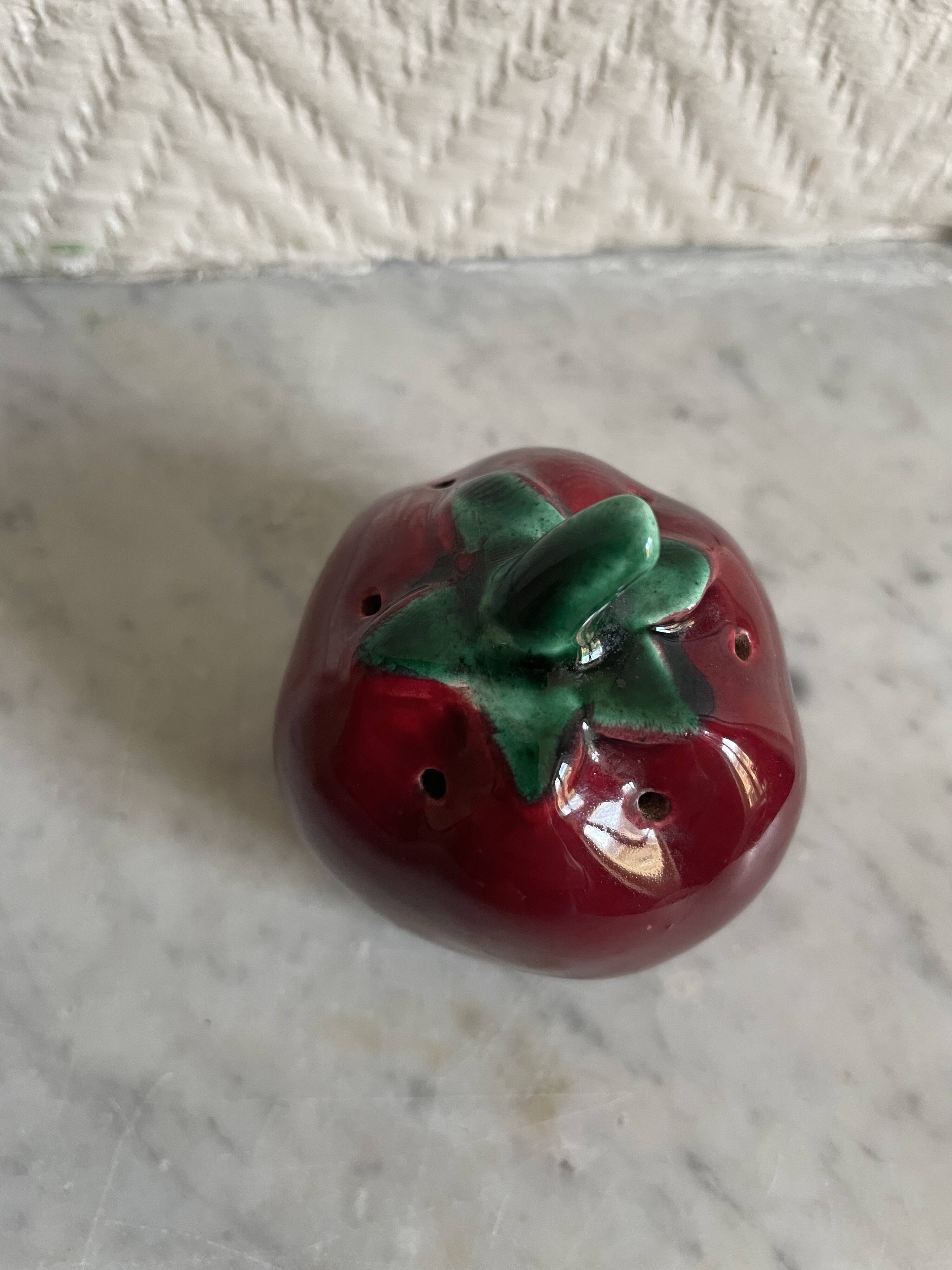 Set of ceramic salt and pepper shakers in the shape of a pumpkin tomato