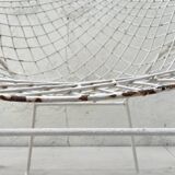 Pair of armchairs in white patinated mesh metal.