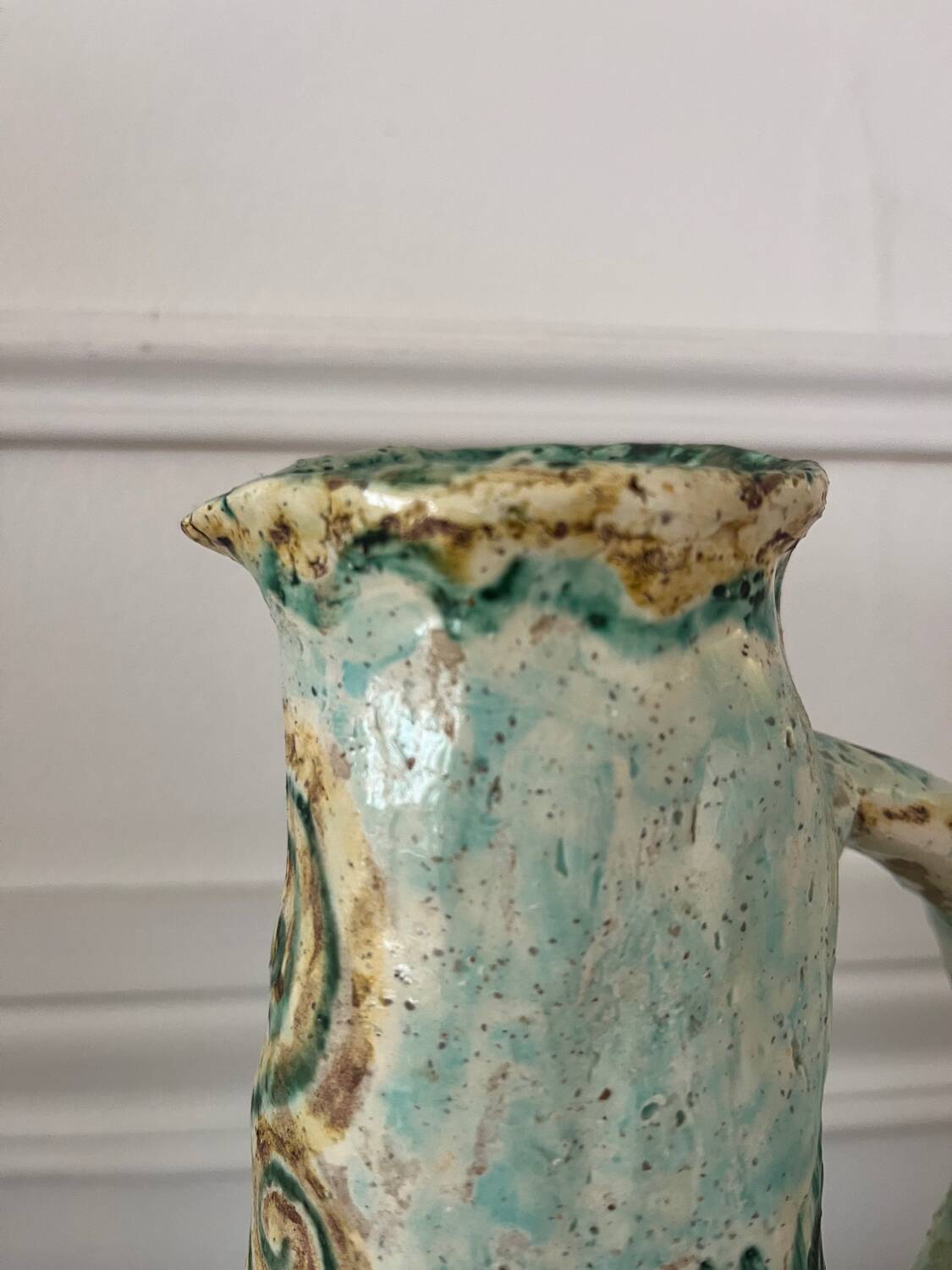 Antique handcrafted ceramic pitcher