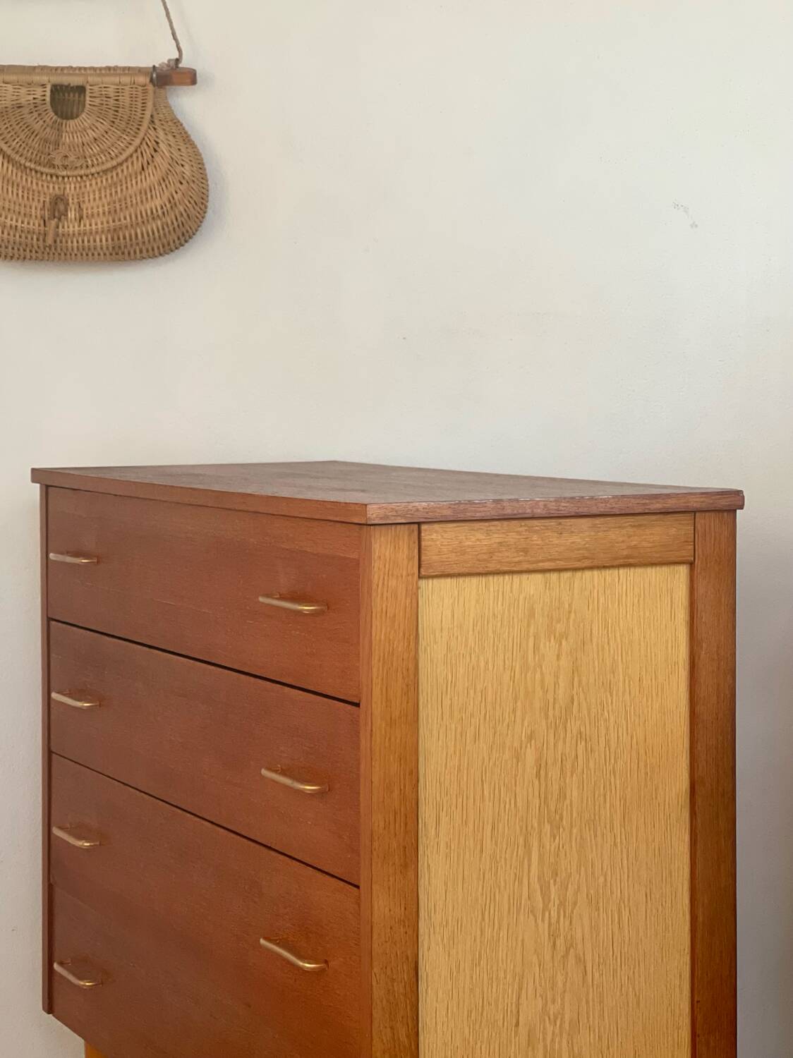 Vintage 1960s chest of drawers with covered handles.