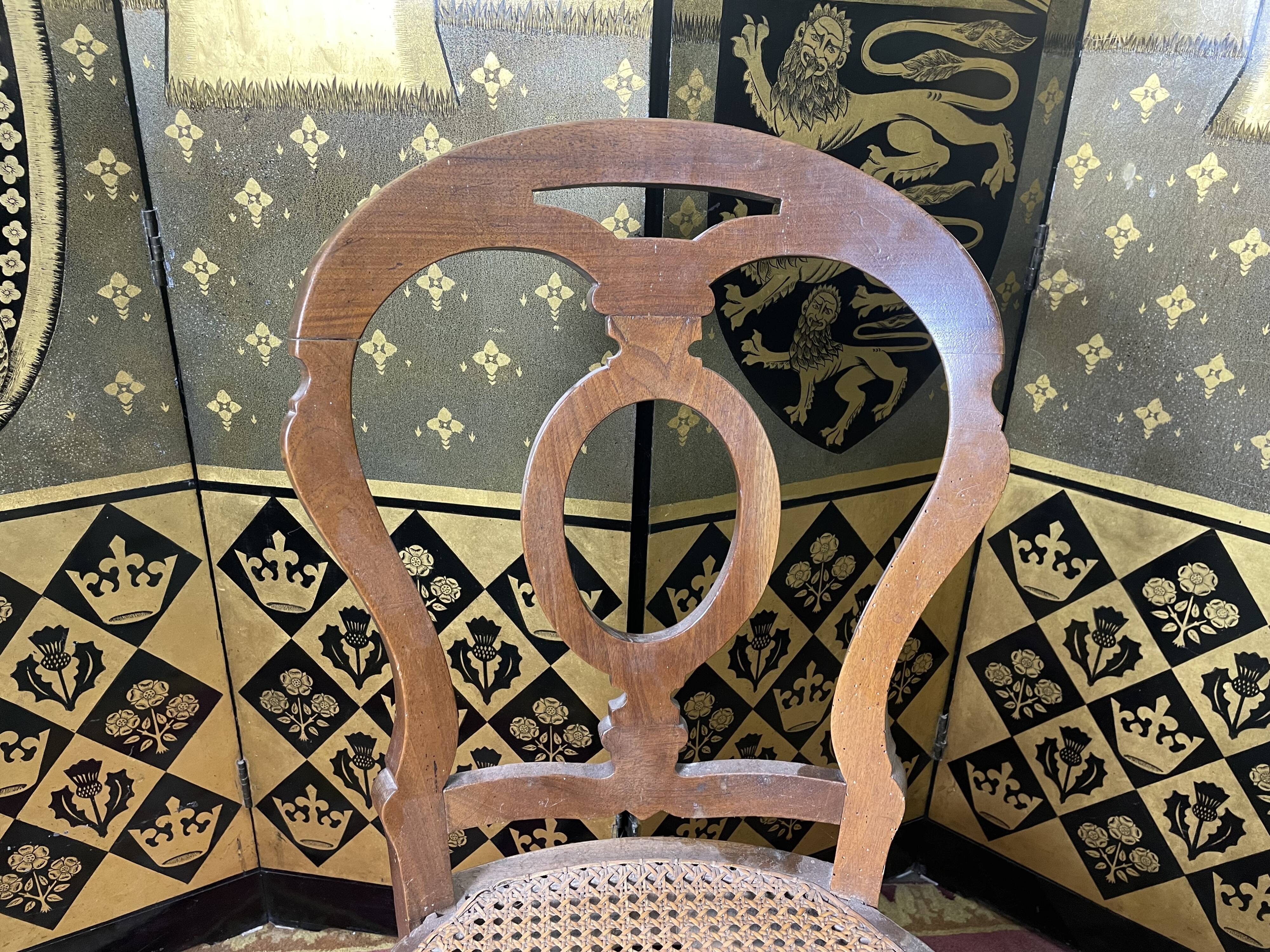 Suite of 12 Louis Philippe period chairs in walnut and canning