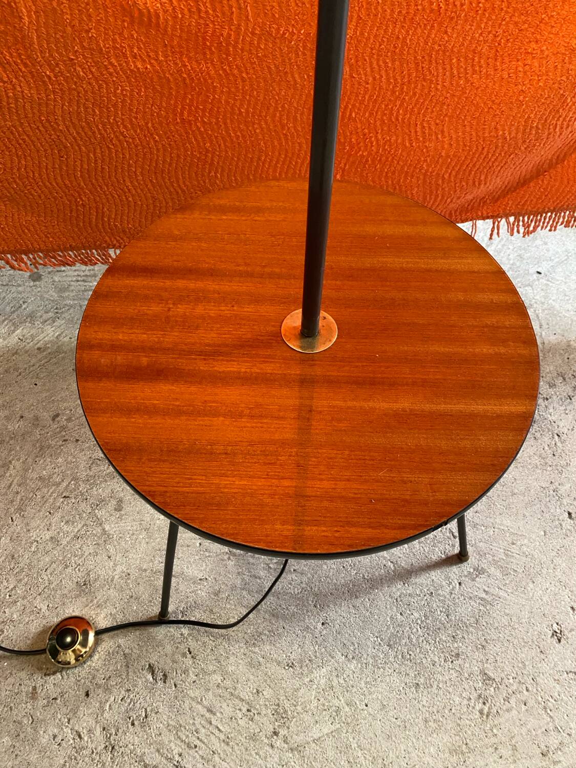 Vintage 1960s floor lamp with black tripod base and round varnished wooden shelf