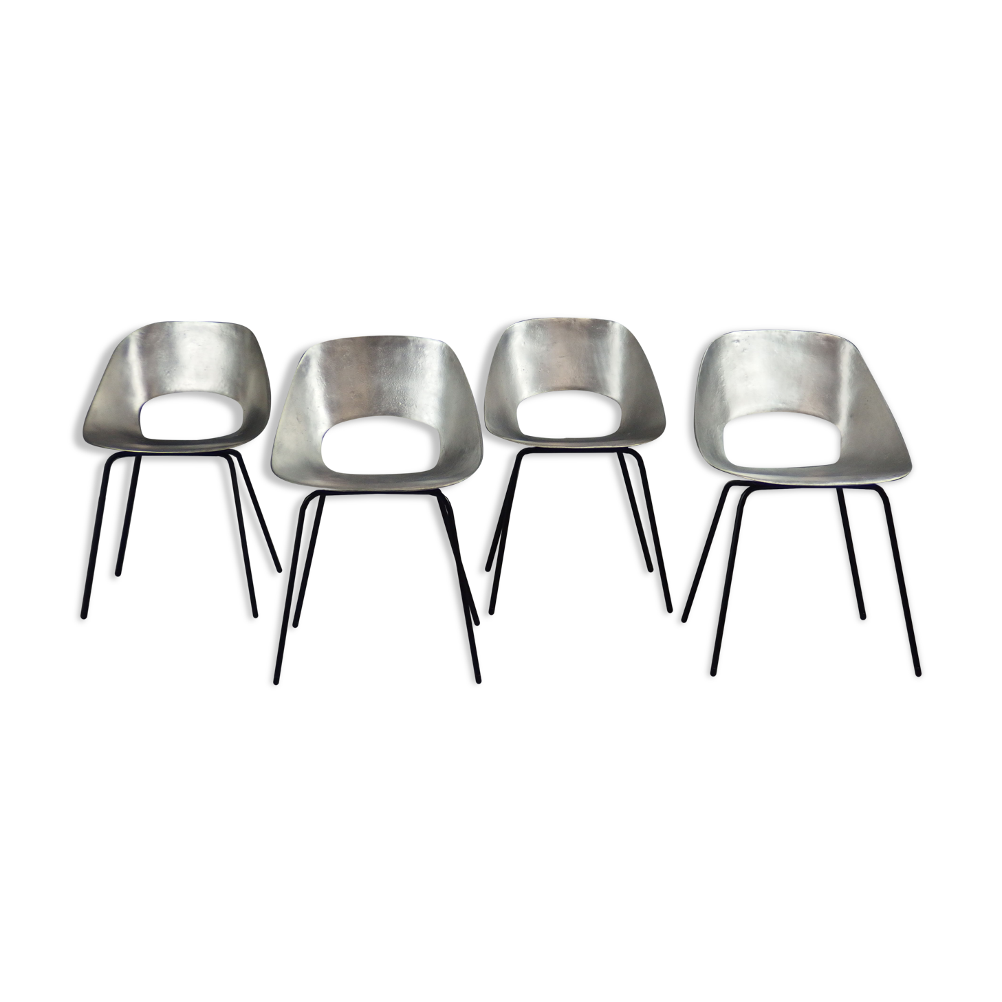Four aluminium chairs by Pierre Guariche