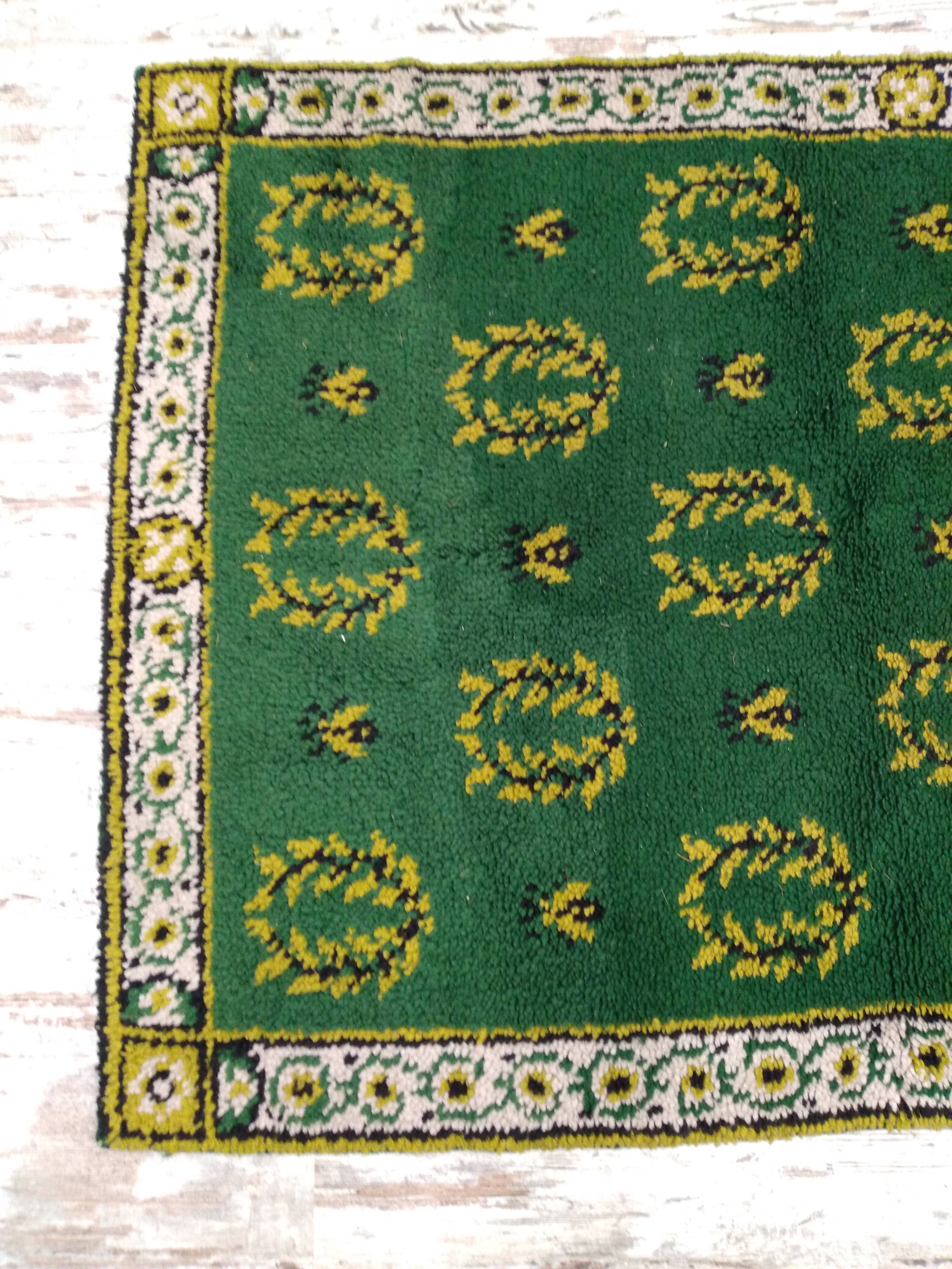 Antique green Berber rug