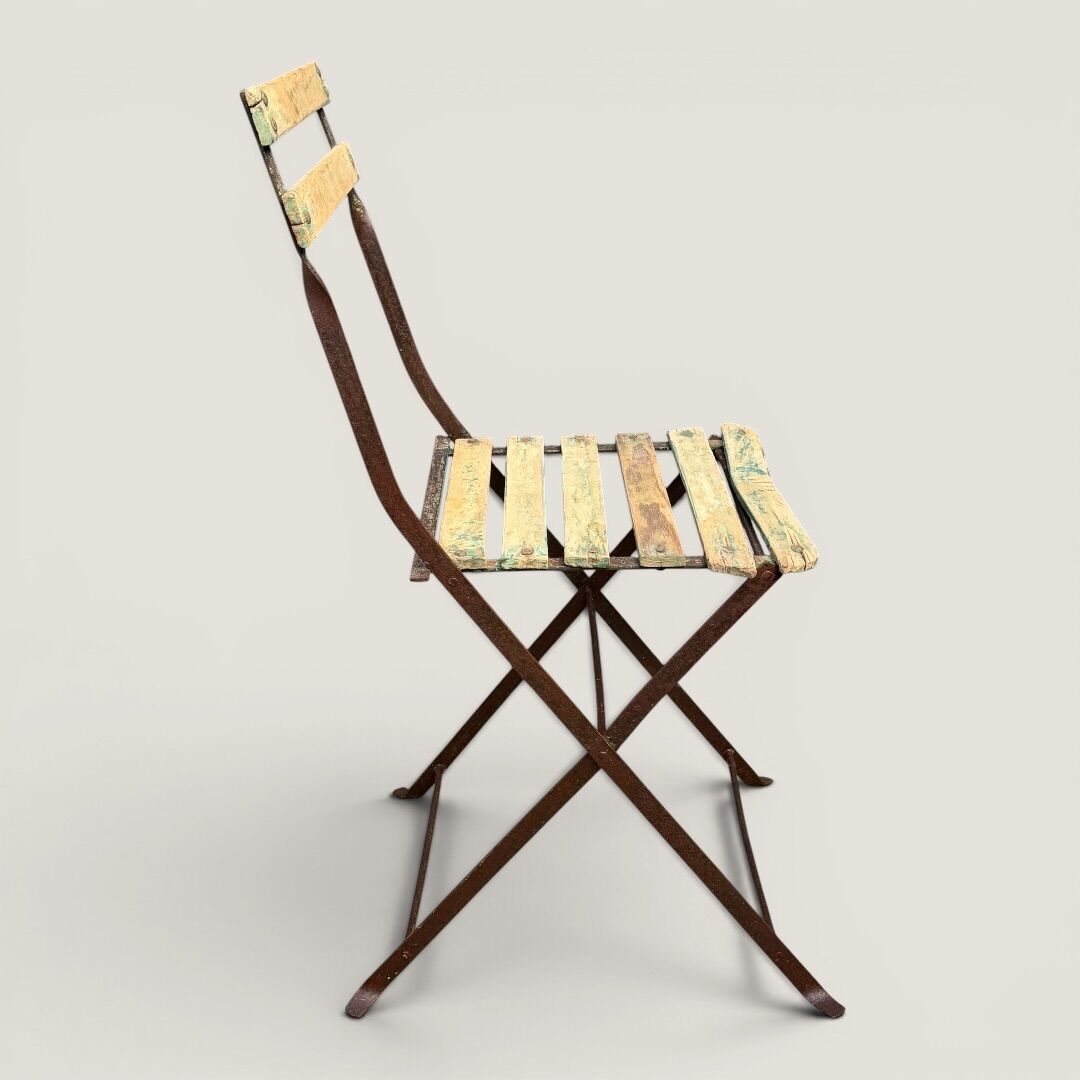 Bistro tables and folding chairs with a patina from the original 1930s.