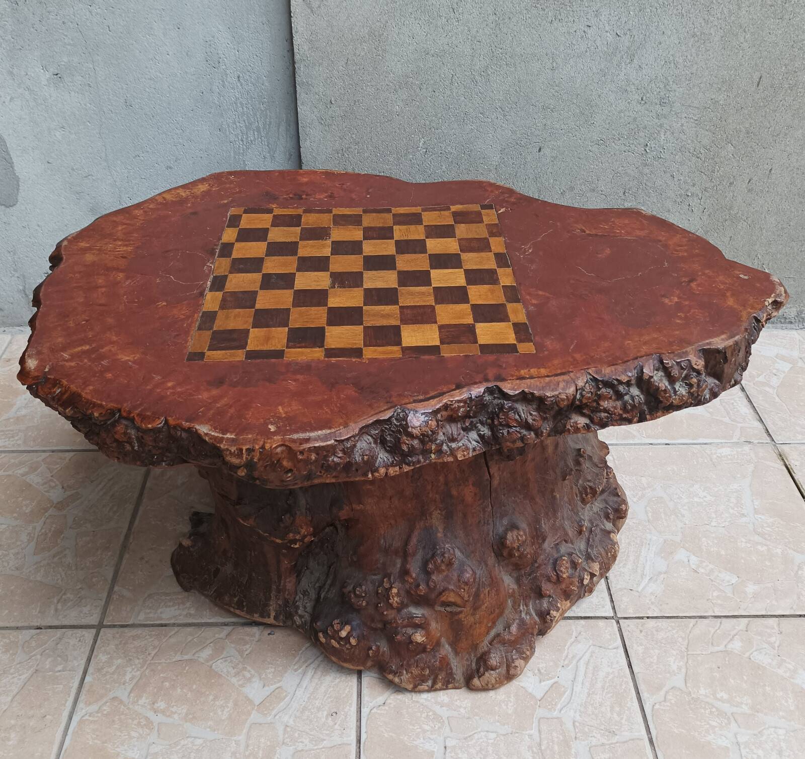 Brutalist chessboard coffee table made from tree stump.