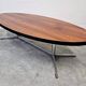Danish Mid Century Modern oval coffee table with a teak top and chrome legs.