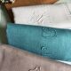 Set of four old damask towels tinted in multiple colors