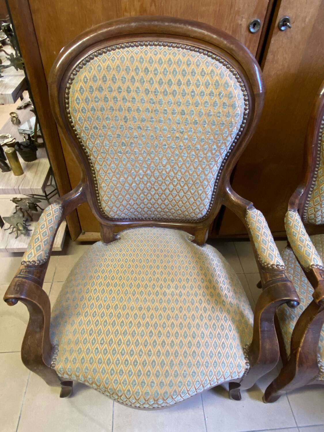 Two Louis XV style wooden and fabric armchairs