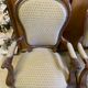 Two Louis XV style wooden and fabric armchairs