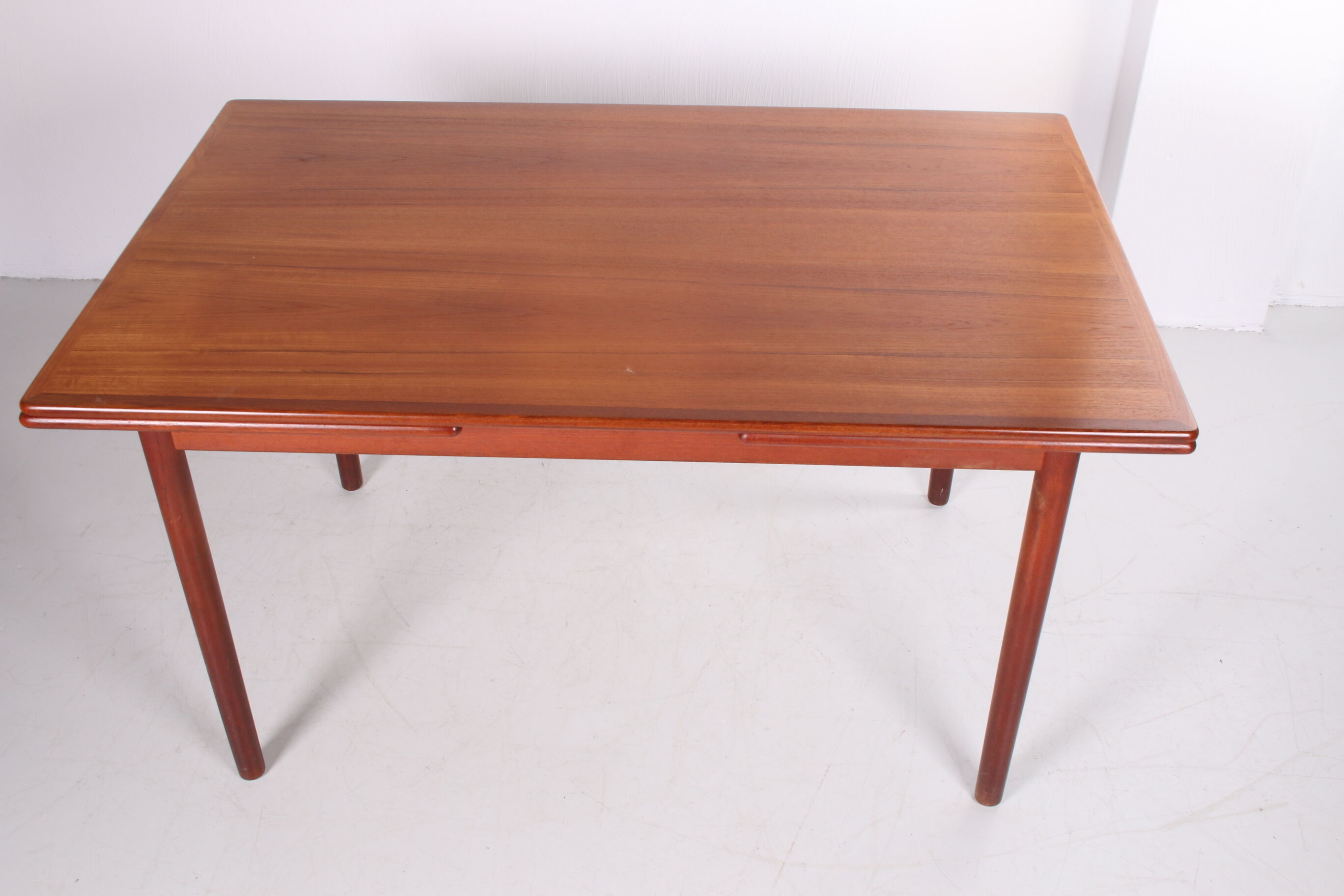 Danish teak draw-leaf dining table