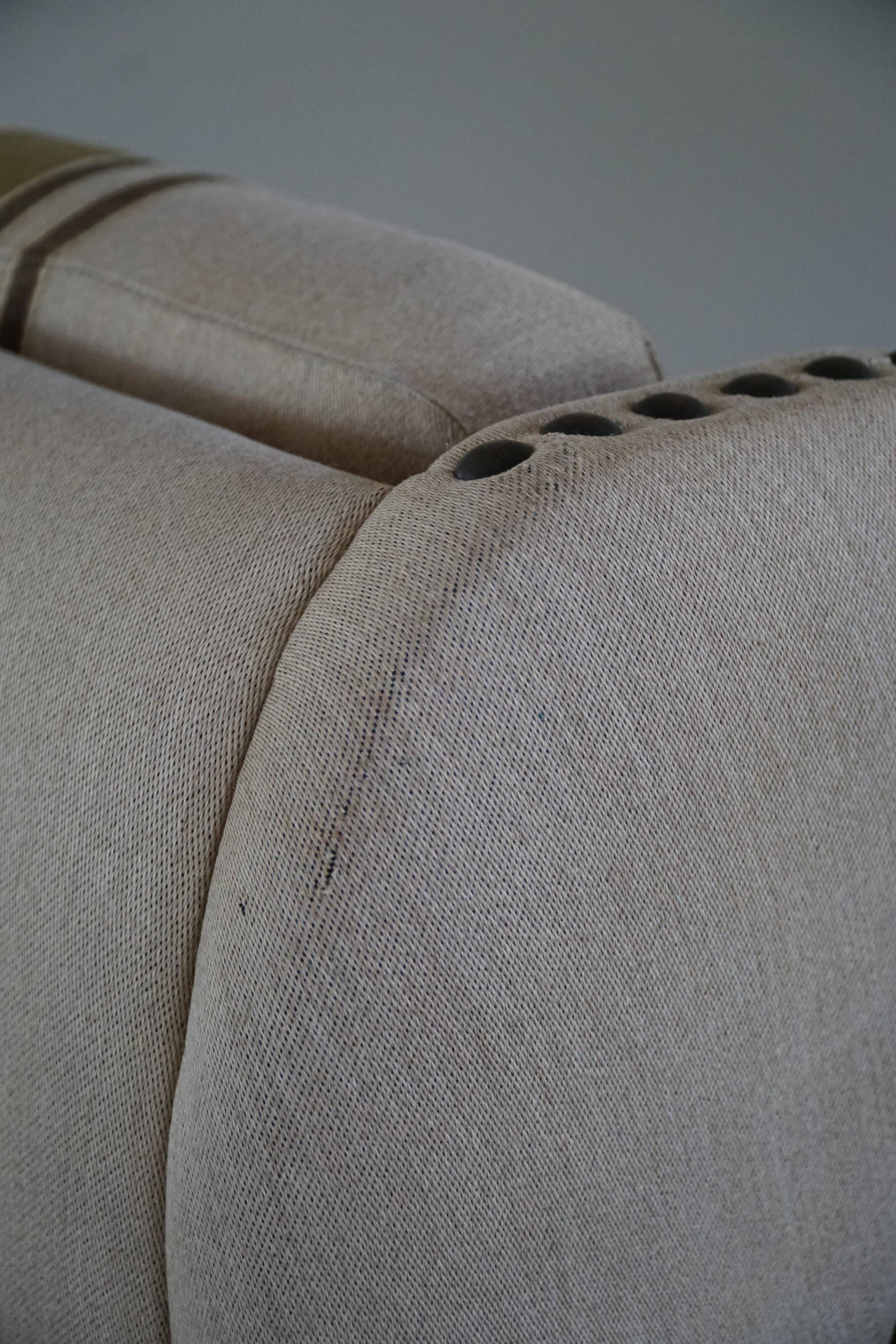 Pair of high-back lounge chairs in modern Danish style in the manner of Henning Kjærnulf, 1960s.