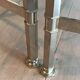 Rare three-part nickel coffee table with lacquered glass tops around the perimeter