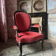 Napoleon III medallion armchair in carved wood and red velvet.