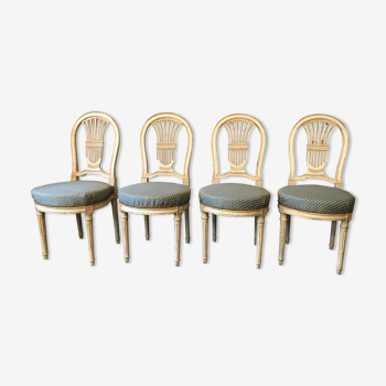 4 lounge chairs with lyre back