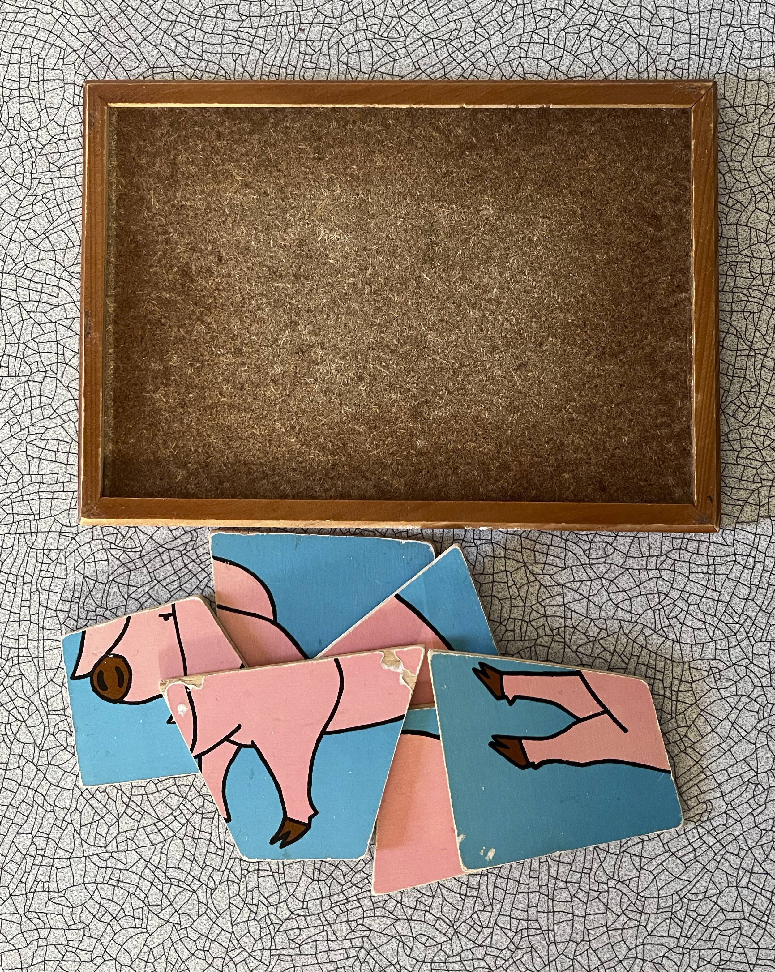 Wooden puzzle frame from the 50s/60s depicting a pink pig