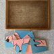 Wooden puzzle frame from the 50s/60s depicting a pink pig