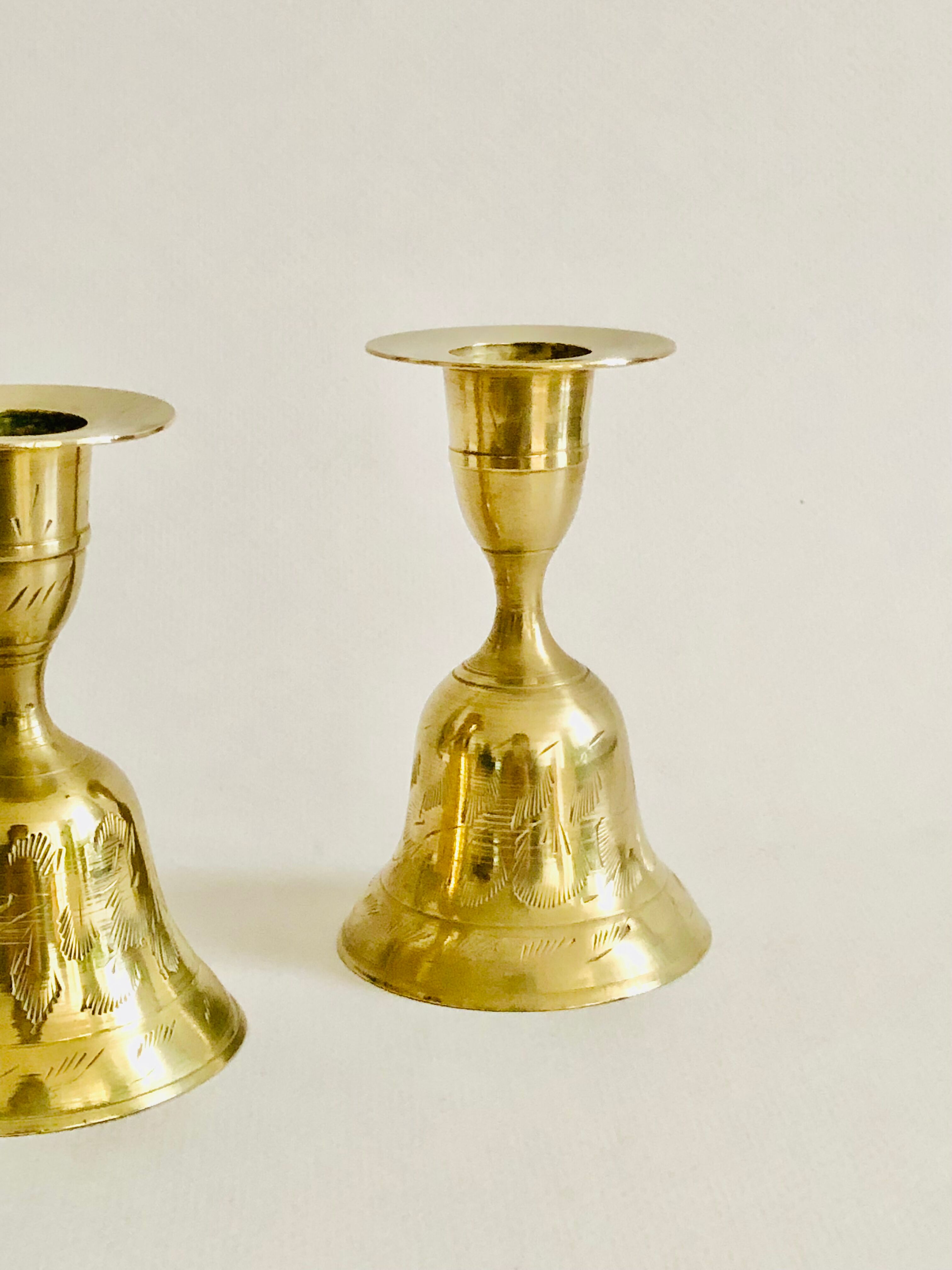 Pair of brass "bell" candle holders