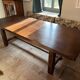 Solid vintage oak dining table in refectory style. Seats 8–10 people.