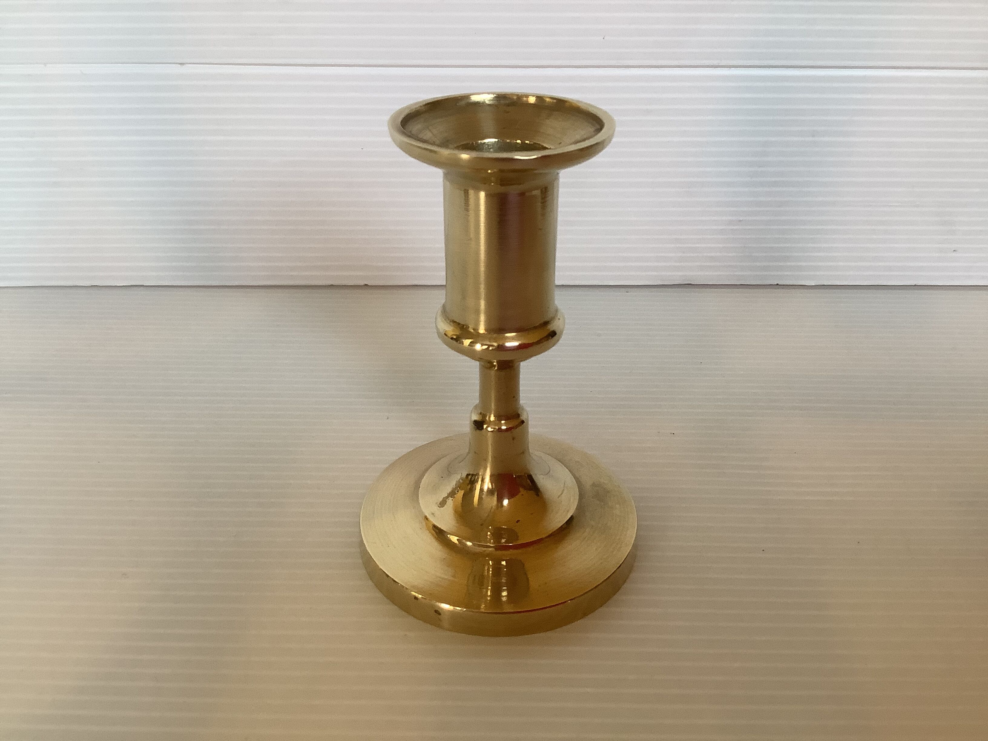 Trio of brass candle holders