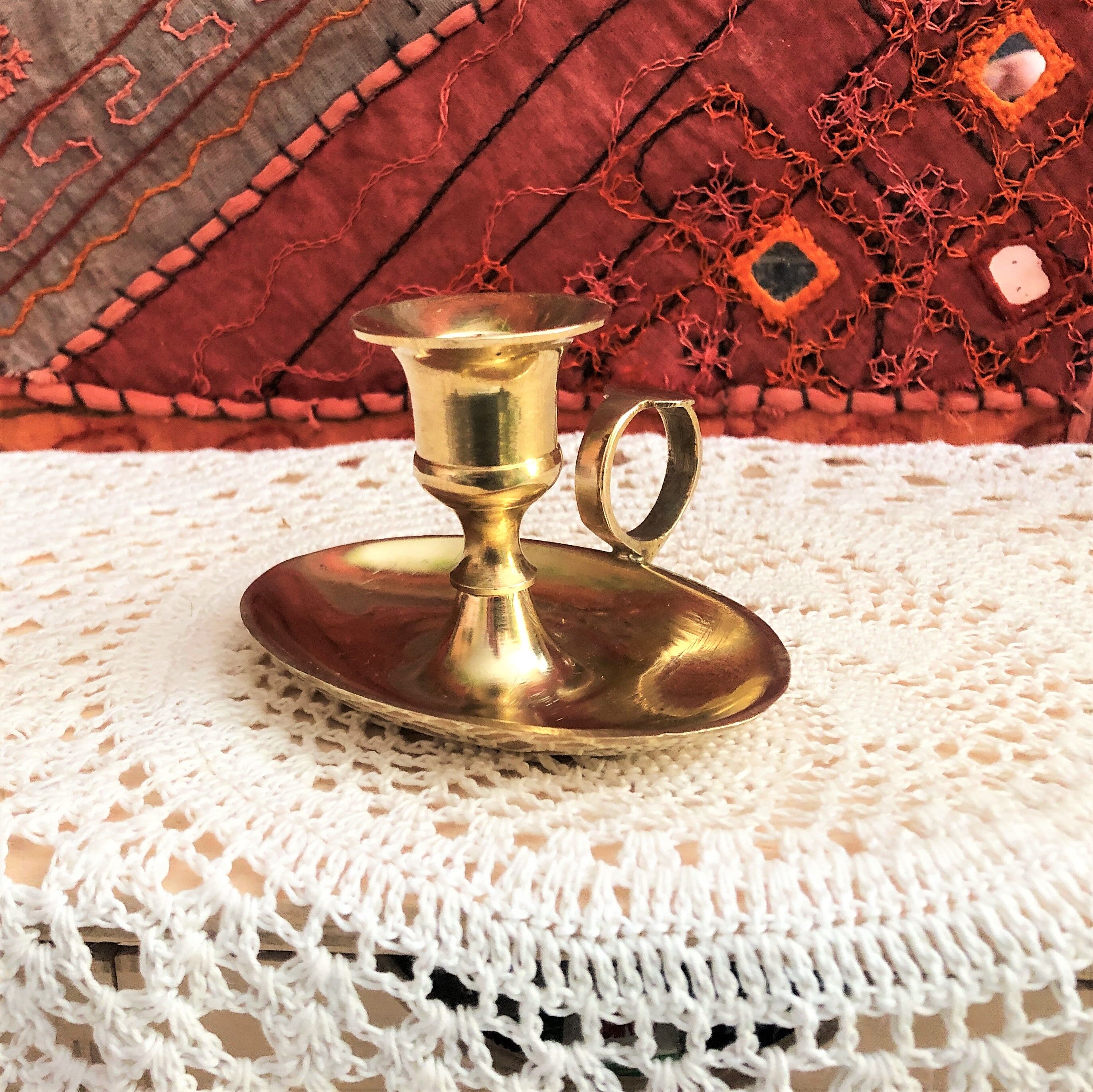 Brass oval hand candle holder