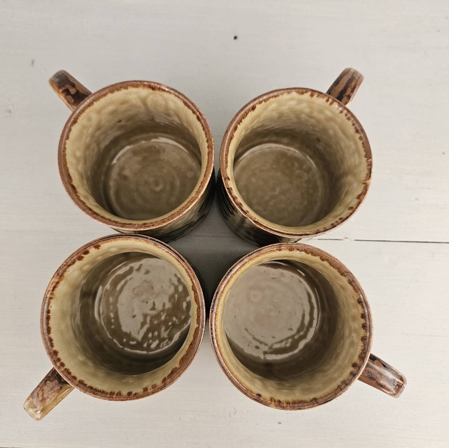 Set of 4 ceramic mugs, glazed stoneware, assorted vintage designs.